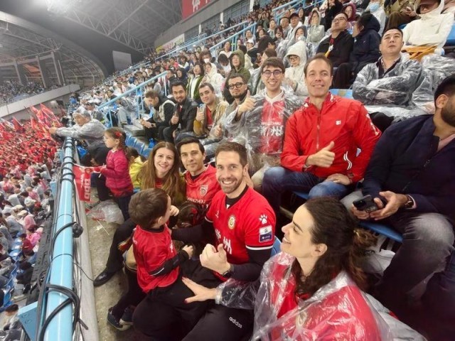 Carlos Lorite watches the opening match of Su Super League with his family and friends, April 11, 2026. Xinhua